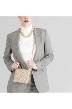 mini bag glitterata con borchie esagonali oro